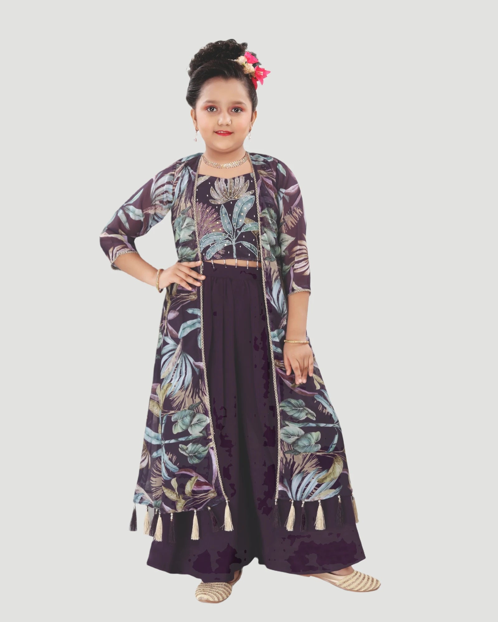 Young girl wearing a dark purple floral outfit on a light gray background