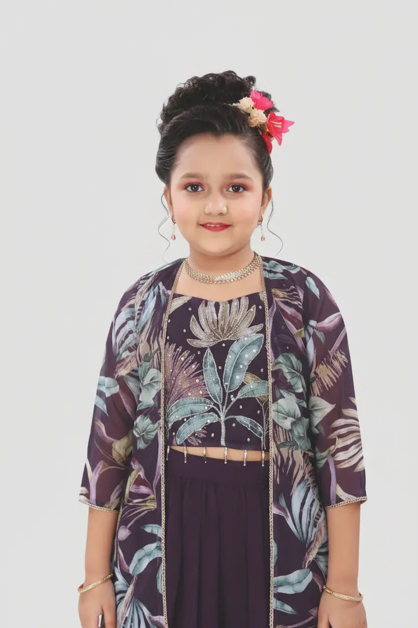Young girl wearing a floral outfit with a plain background