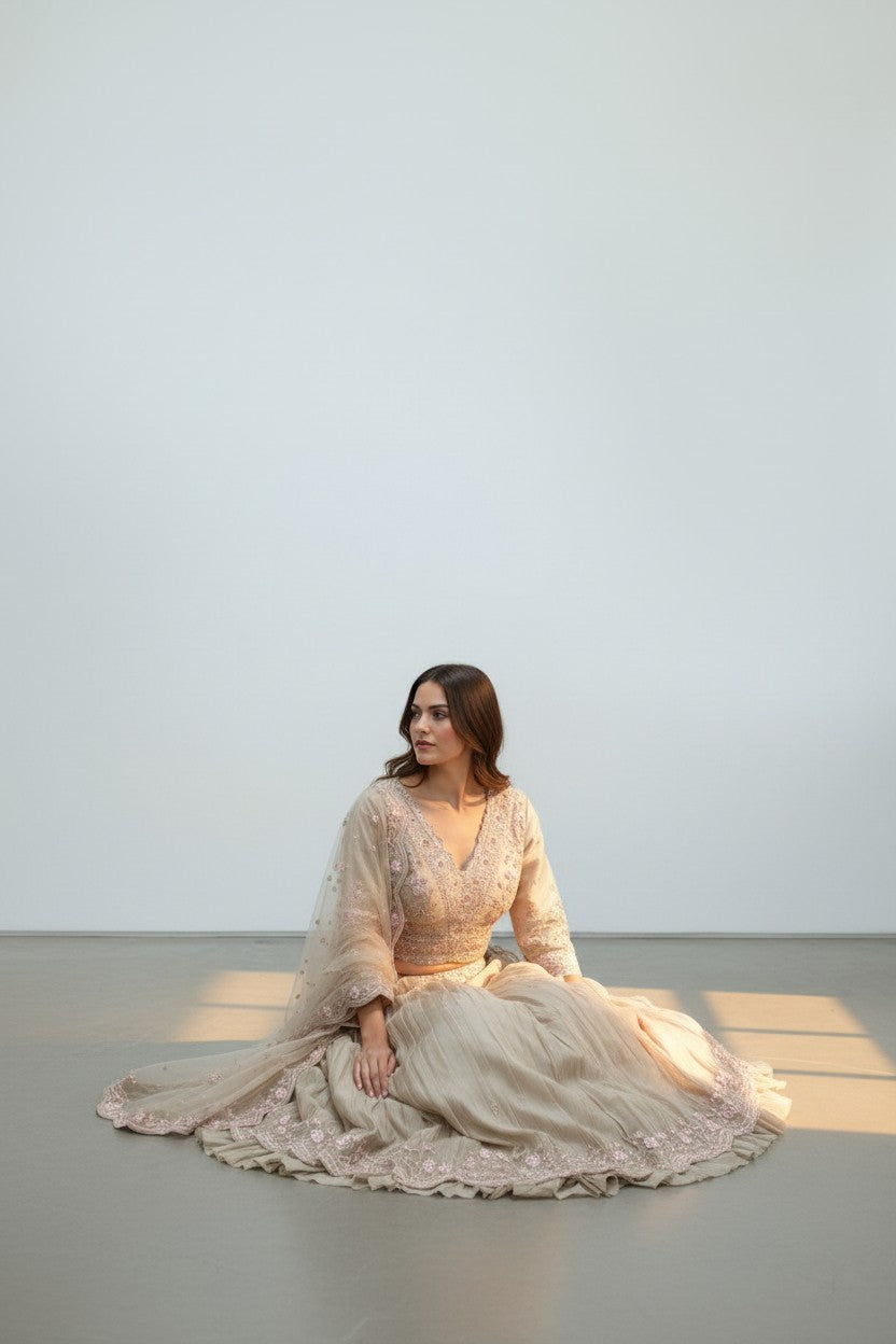 Rangoli beige silk lehenga choli with pink floral embroidery and dupatta. Elegant ethnic wear for special occasions.