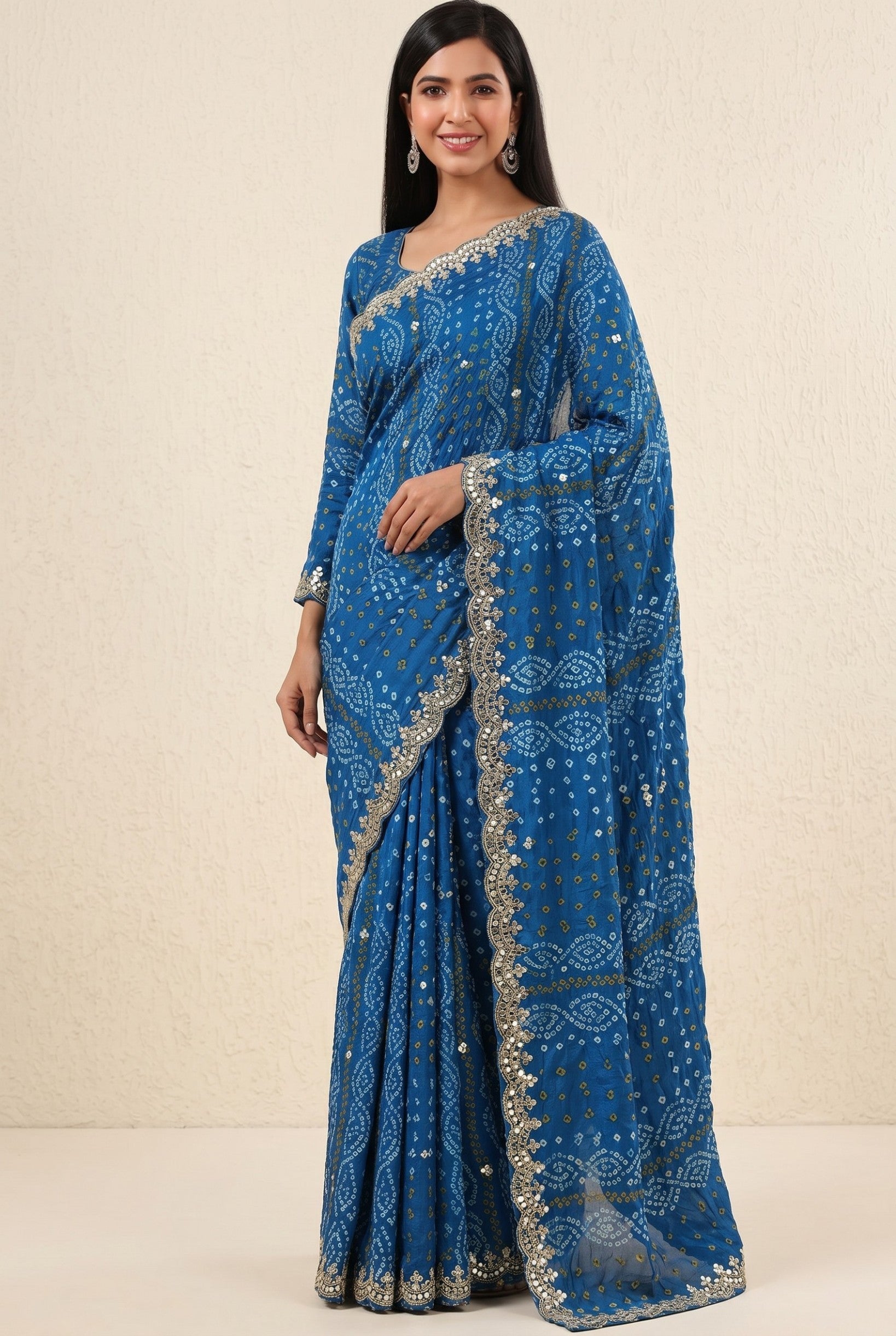 Rangoli blue georgette saree with traditional bandhani print, sequin and mirror work border and pallu.
