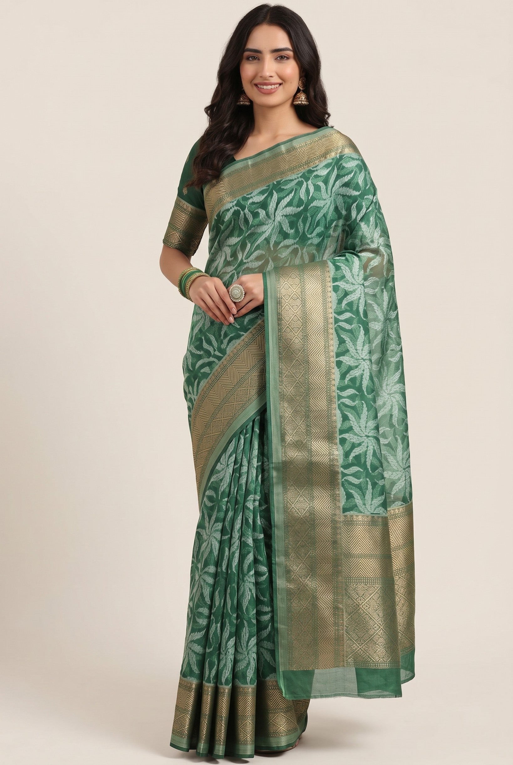 Rangoli women's green Kanjeevaram silk saree with all-over white floral motif and golden border. Perfect for special occasions.