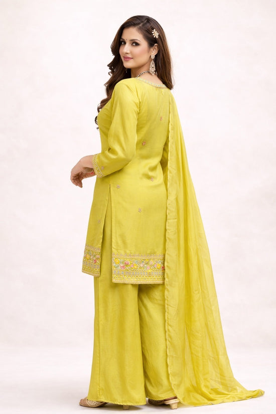 Rangoli lime green embroidered kurta with palazzo pants and dupatta, featuring intricate neckline and hem embroidery.