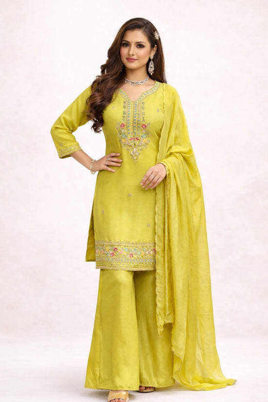 Rangoli lime green embroidered kurta with palazzo pants and dupatta. Lightweight fabric with intricate neckline and hem embroidery.