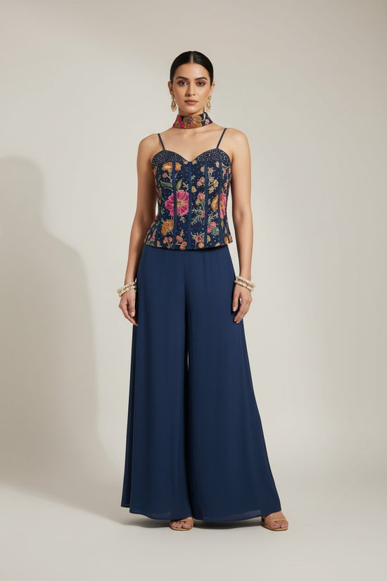 Rangoli navy blue embroidered corset top with floral motifs and wide leg palazzo pants.