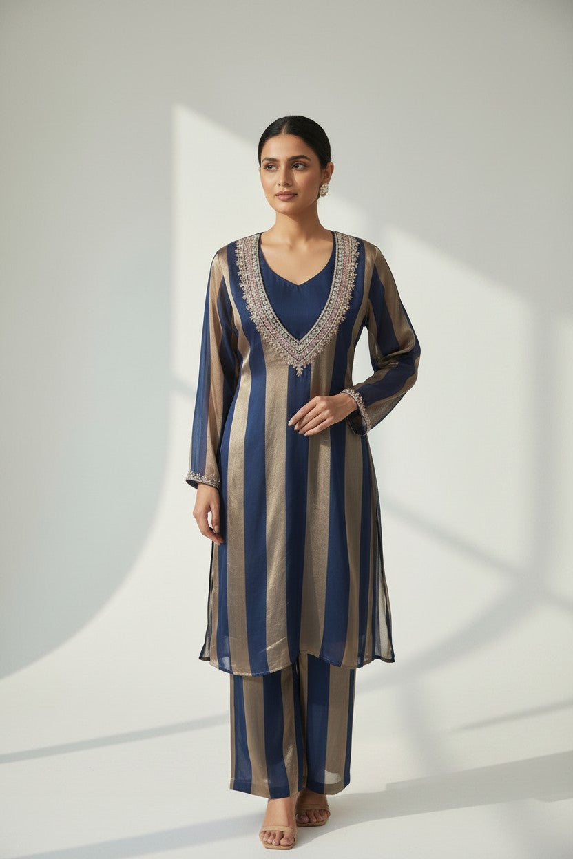 Rangoli navy and gold striped silk blend V-neck kurta with embroidered neckline and matching pants.