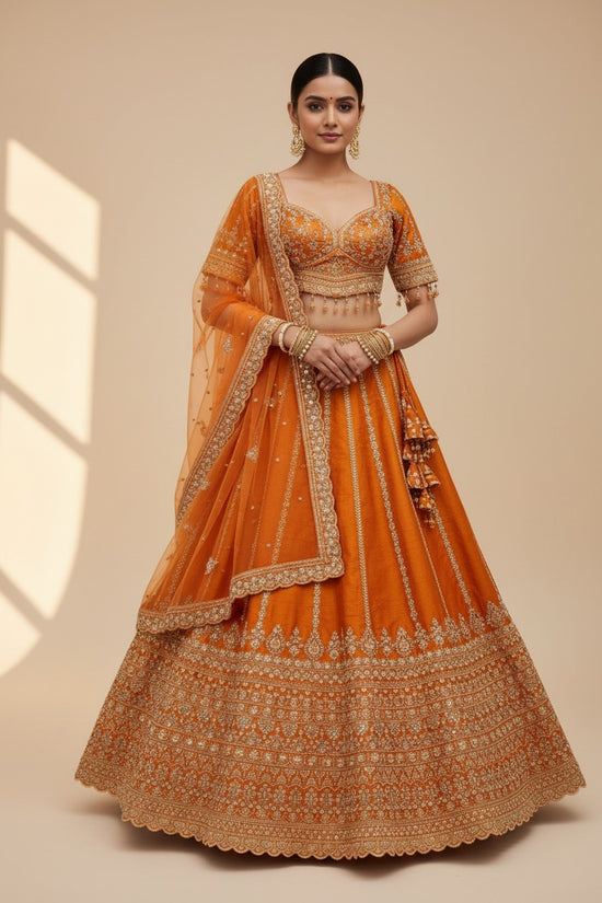 Rangoli orange silk lehenga with gold embroidery, beadwork, and net dupatta. Perfect for celebrations.