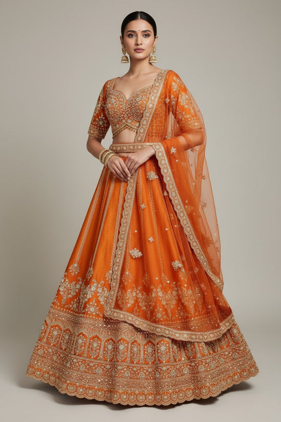 Rangoli orange silk lehenga with intricate embroidery, zari work, sequins, and net dupatta. Perfect for festive occasions.