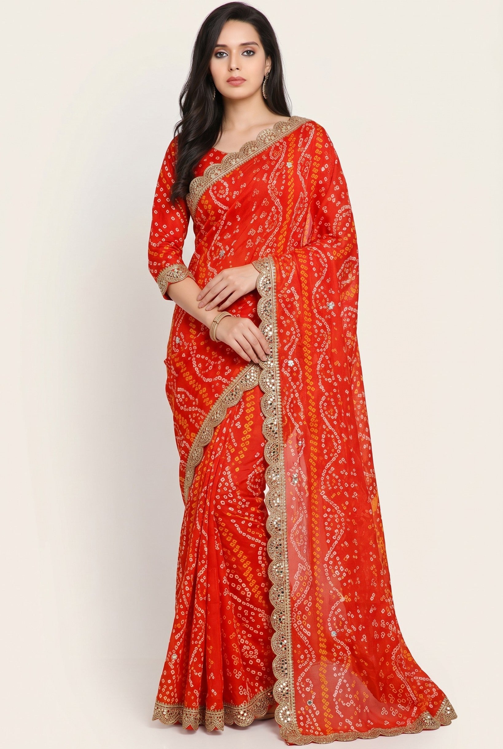 Rangoli orange silk bandhani saree with white and yellow tie-dye pattern, sequin and mirror work border.