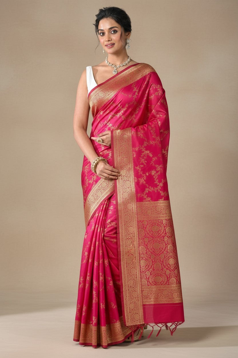 Rangoli pink silk brocade saree with intricate golden zari weaving and traditional motifs. Perfect for festive occasions.