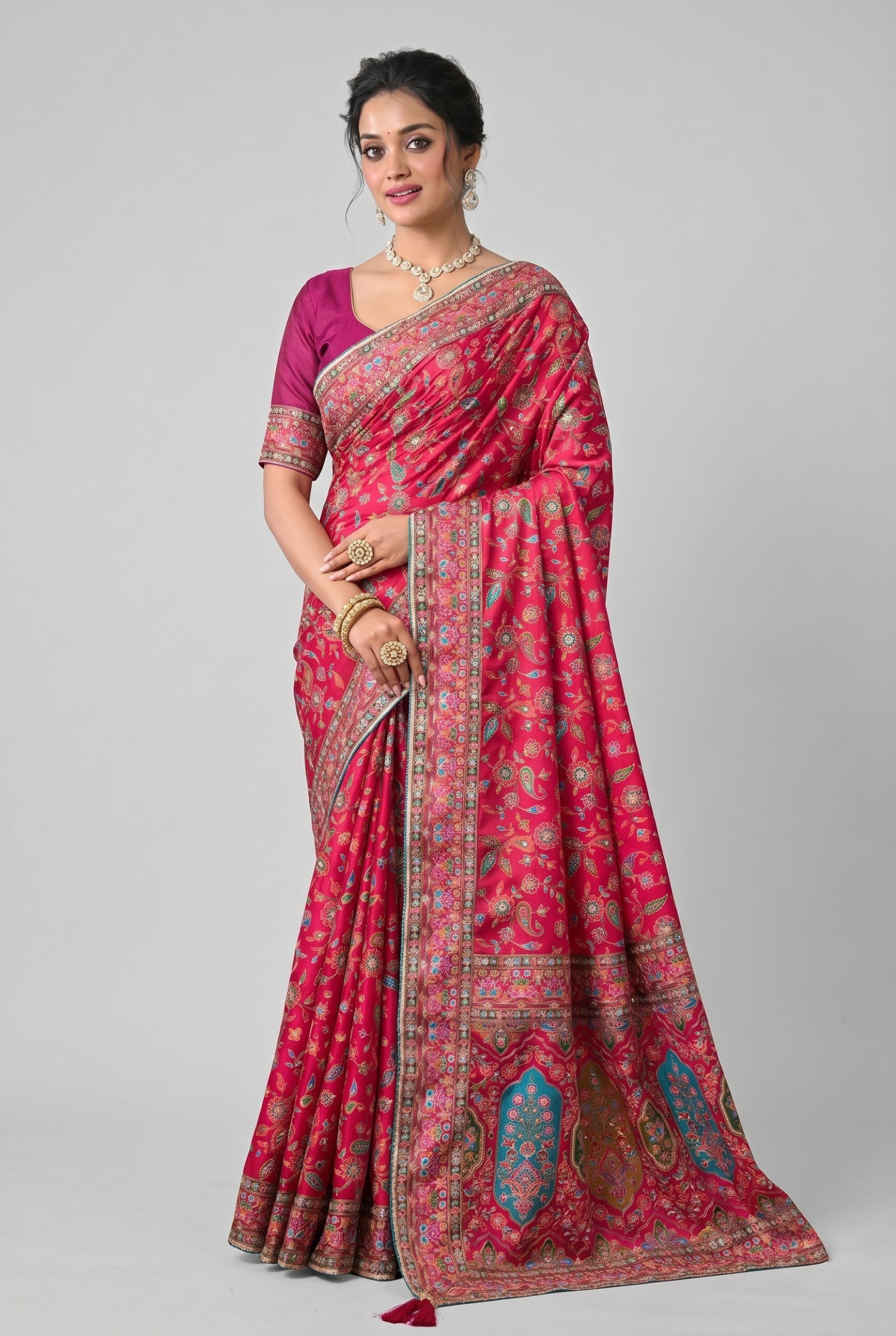 Rangoli vibrant pink silk saree with intricate paisley motif embroidery and a detailed border. Perfect for special occasions.
