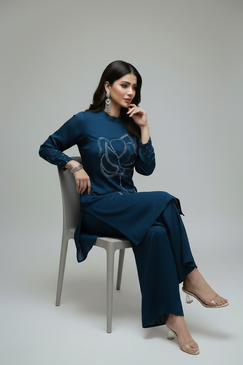 Rangoli teal embellished floral print kurta with palazzo pants. Flowing fabric, round neckline, long sleeves, beadwork.