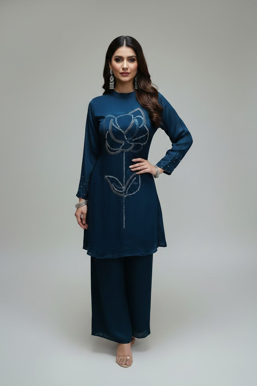 Rangoli teal embellished floral print kurta with palazzo pants. Flowing fabric, round neckline, long sleeves, beadwork.