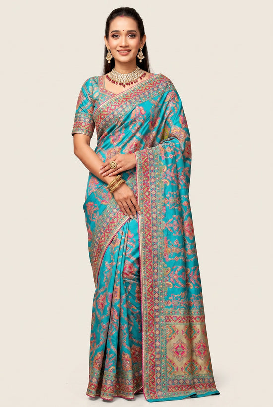 Rangoli teal silk saree with intricate paisley motifs, detailed border, and matching blouse. Perfect for special occasions.