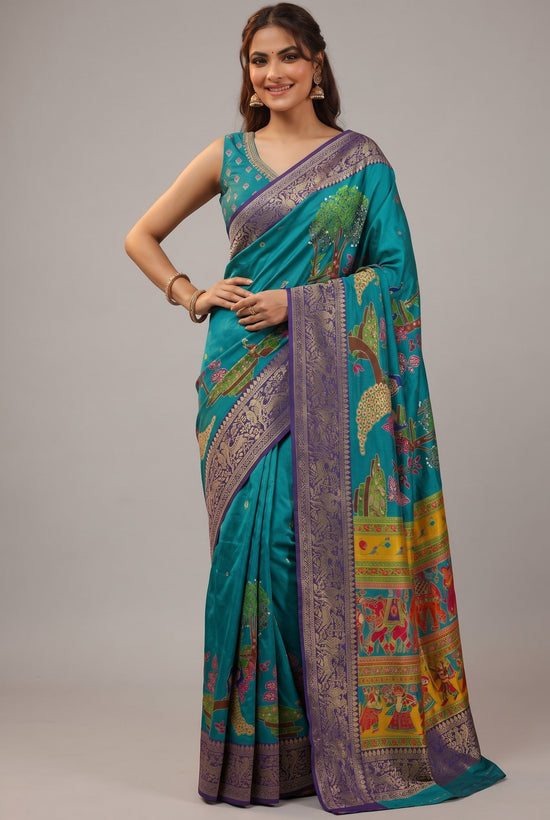 Rangoli teal silk saree with purple border, featuring whimsical trees, animals, and human figures. Traditional motifs and subtle embellishments.