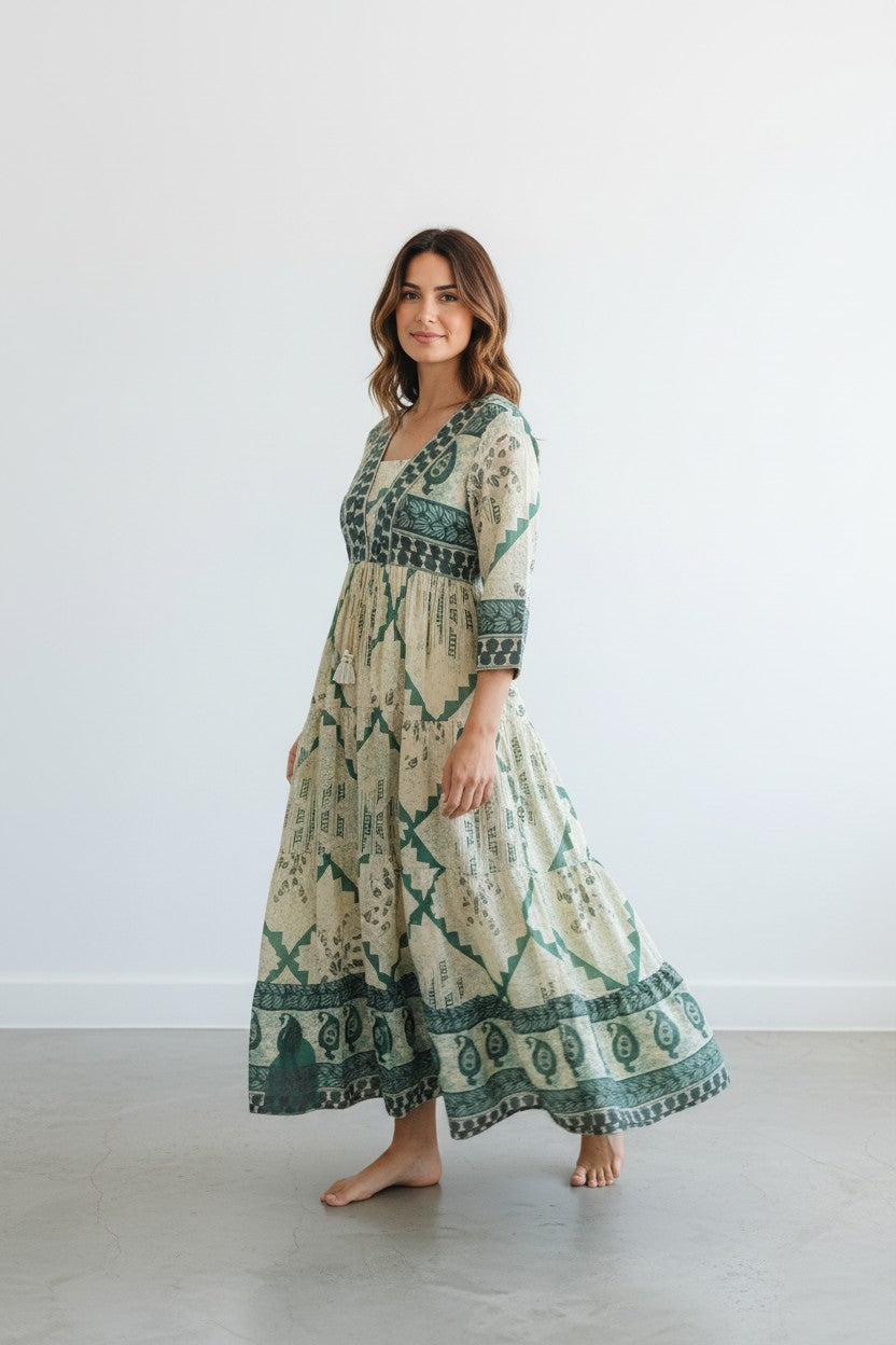 Rangoli cream and deep teal tiered maxi dress with V-neckline and vintage-inspired print. Lightweight fabric, perfect for summer.