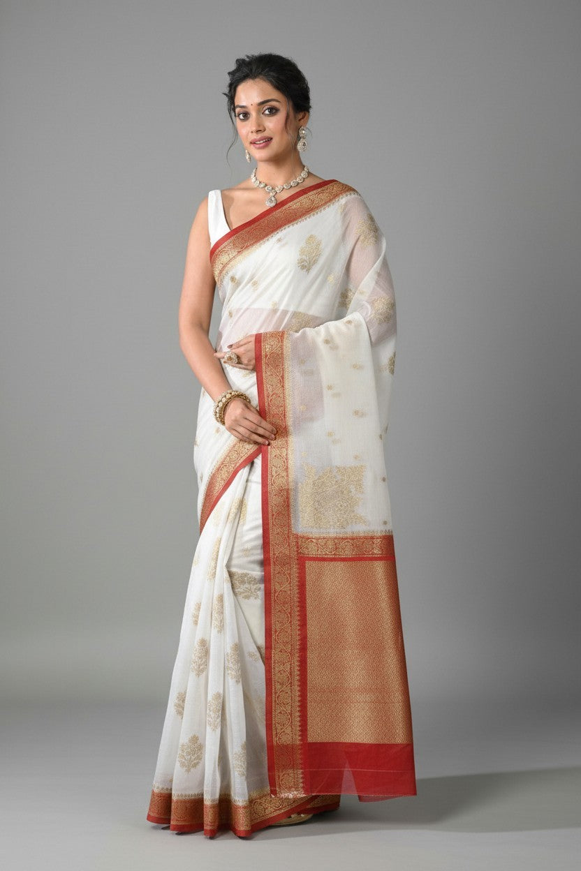 Rangoli white cotton silk saree with red and gold border, intricate woven motifs, perfect for special occasions.