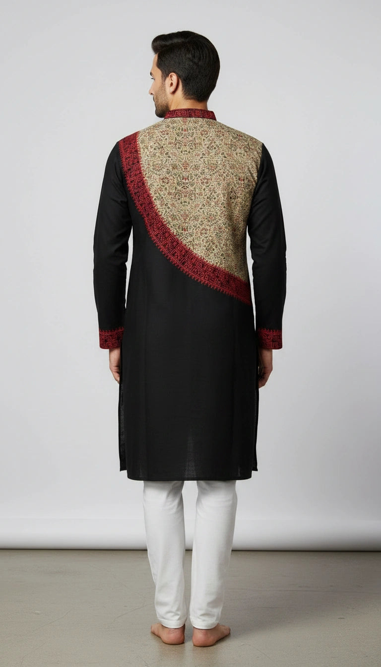 Man wearing a traditional black kurta with a patterned maroon and beige shawl on a plain background